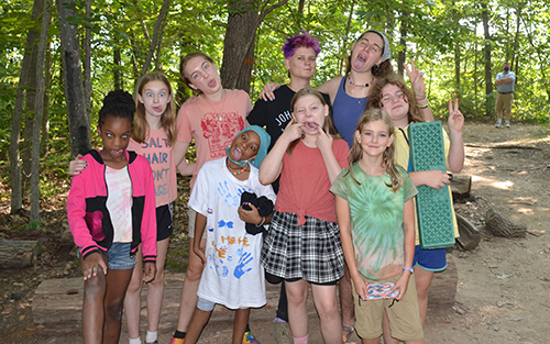 Group of campers posing with silly faces