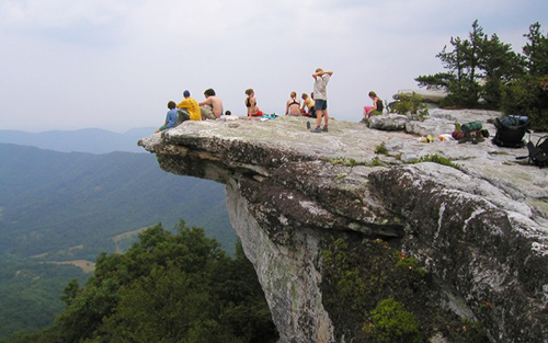 Hikers on a large rock formation