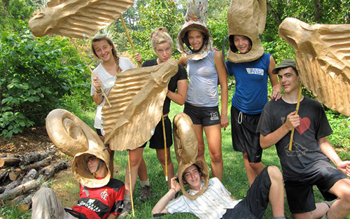 Teen Adventure kids in paper mache costumes on a service day