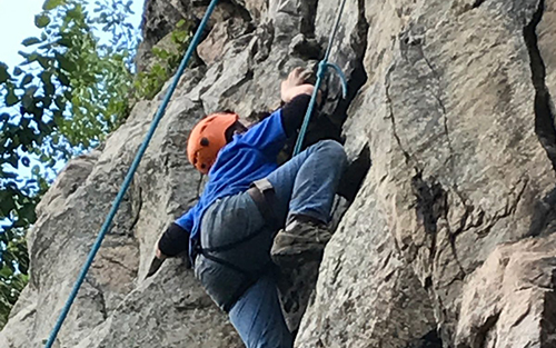 Boy rock climbing